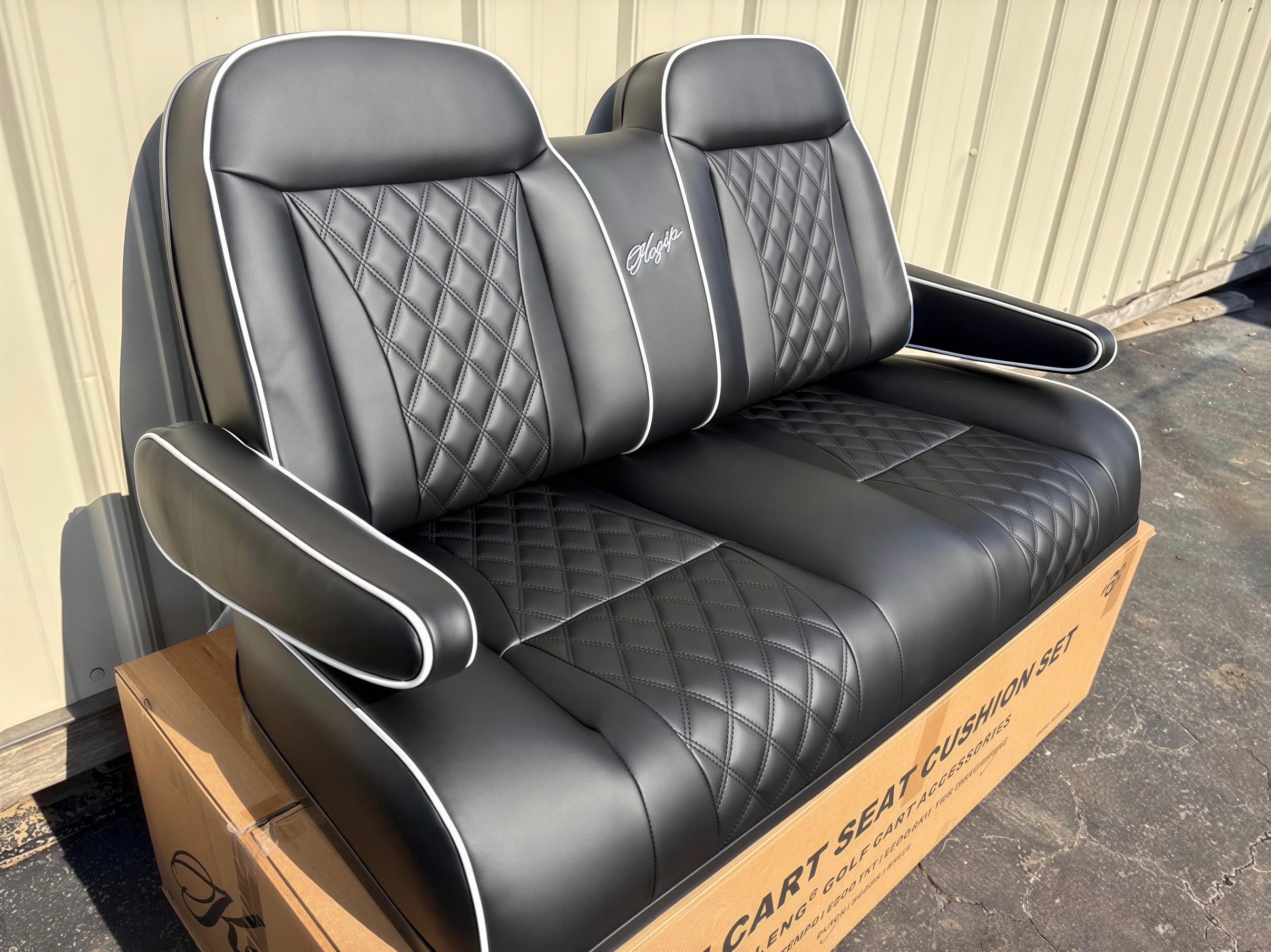 Black golf cart front seat with diamond stitching, white piping, contoured backrests and armrests